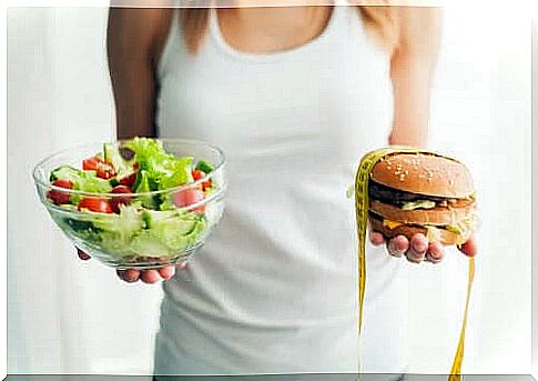 Woman holding food to prevent obesity and a burger