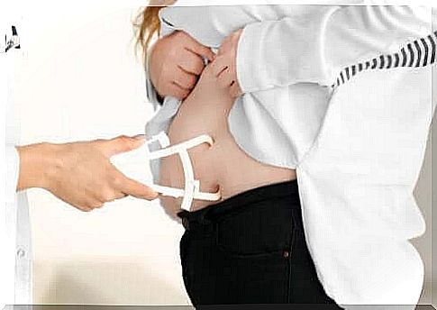 Doctor measuring a patient's belly