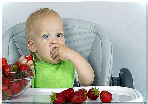 A child eating strawberries