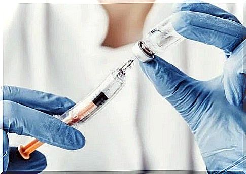 Doctor handling a vaccine syringe